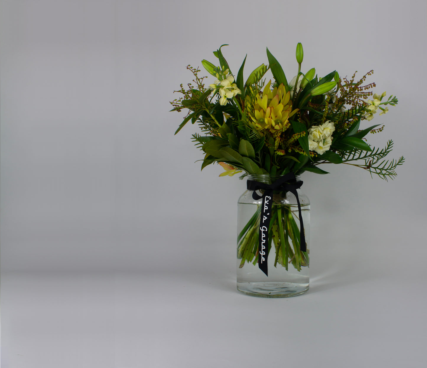 Large neutral flower bouquet in glass vase β $100 size