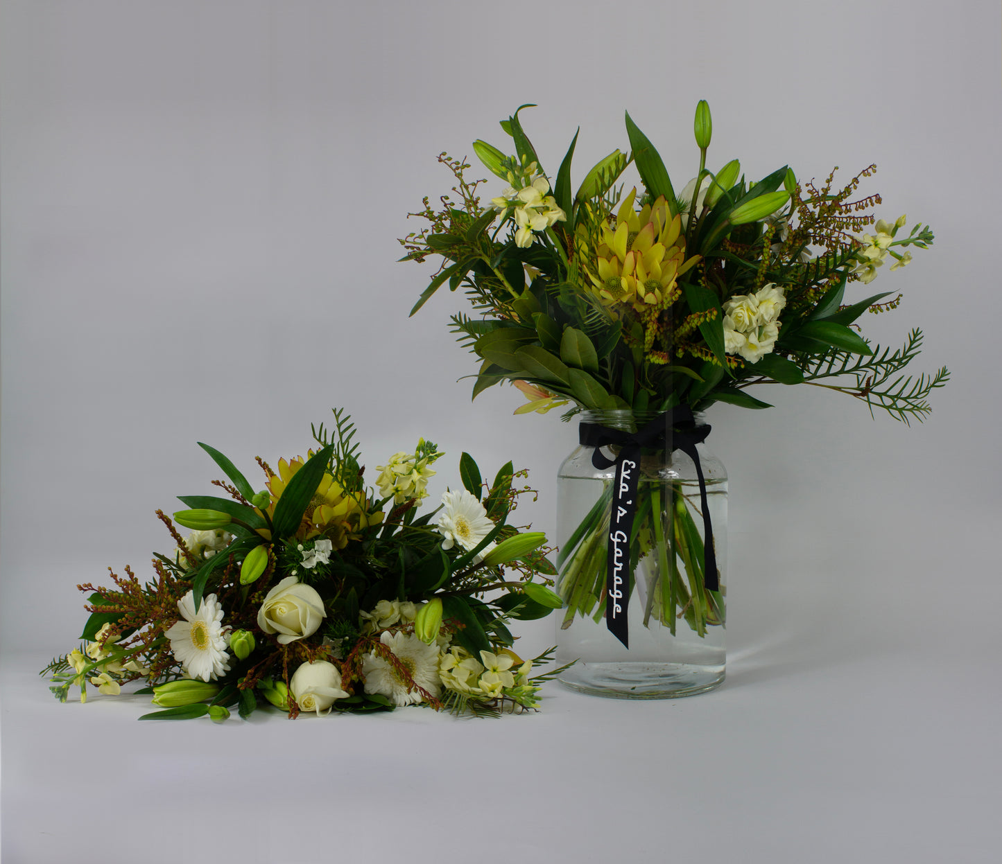 Neutral toned flower bouquet in vase – $100 arrangement