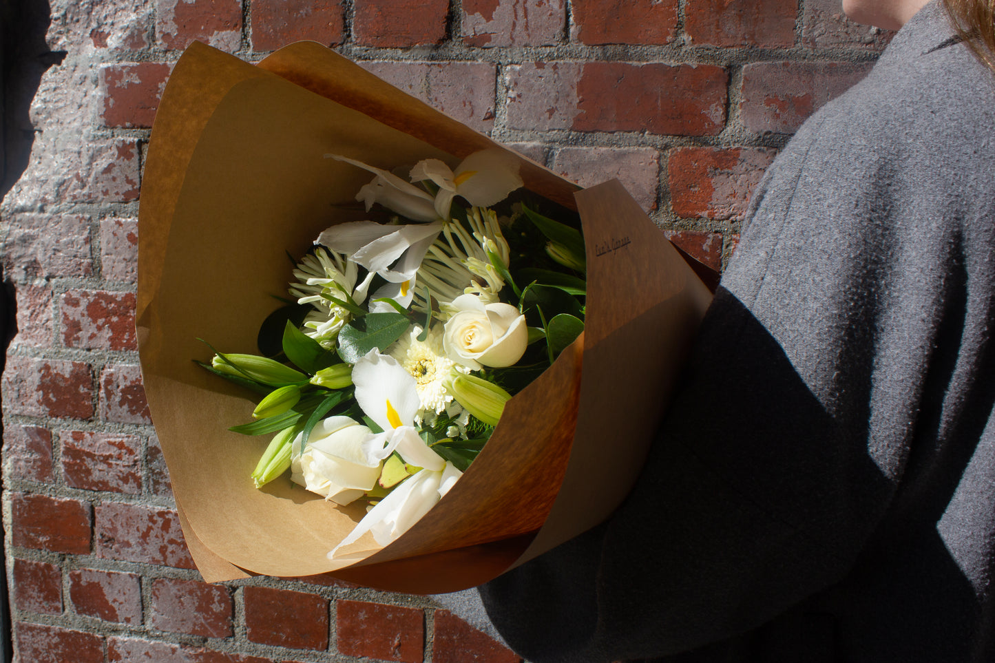 Medium neutral flower bouquet wrapped in kraft paper – $75 size
