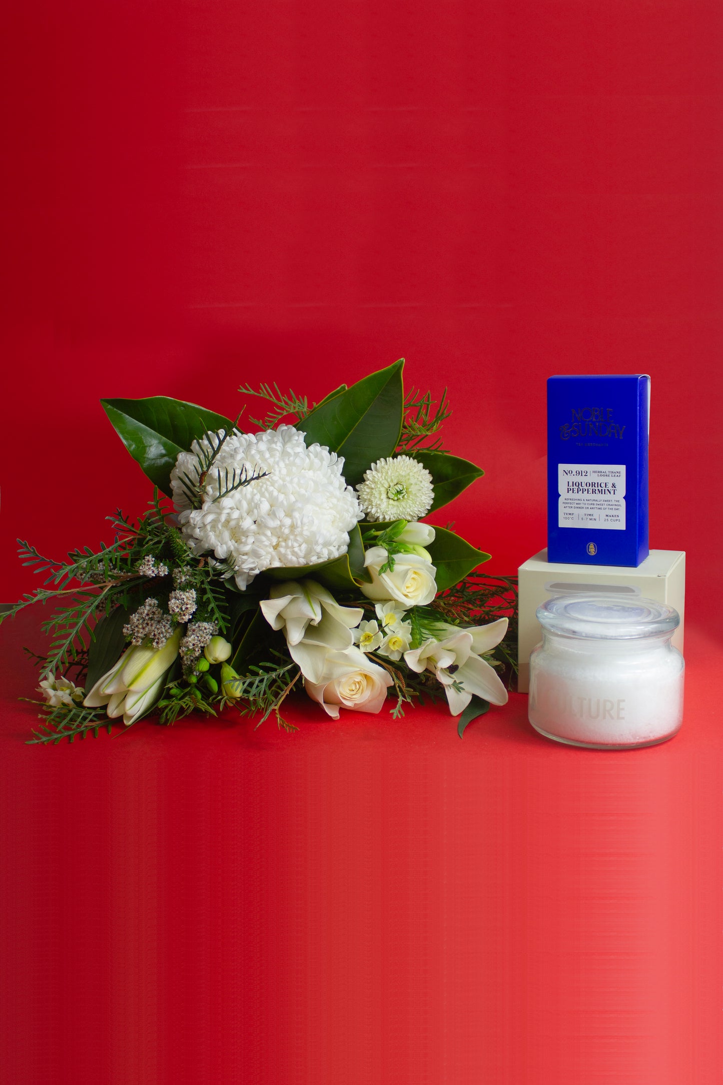 Flower bundle with candle and tea