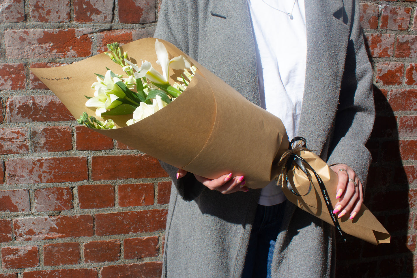 Neutral toned flower bouquet wrapped in kraft paper – $45 size