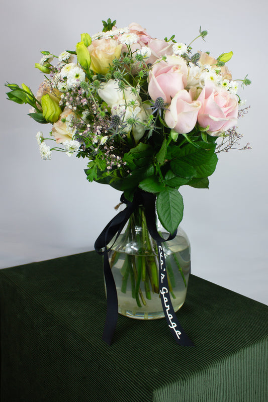 Large pastel bouquet with pinks, creams, and lavender tones