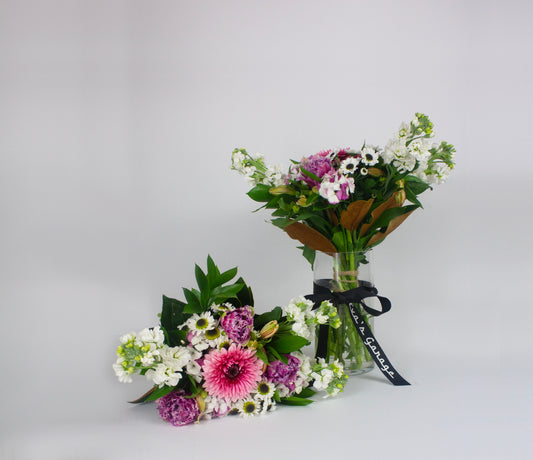 Medium pastel bouquet with pinks, creams, and lavender tones. 